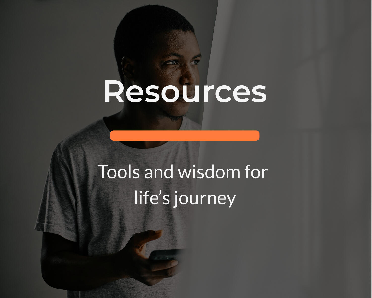 Man looking thoughtfully at phone — button linking to Resources page with book, podcast, and app/website recommendations for men seeking tools and wisdom for life’s journey.